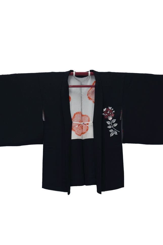 Vintage Haori with floral embroidery and Shibori lining on a black background