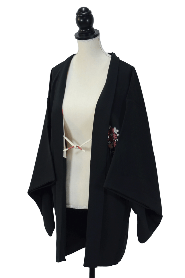 Vintage Haori with floral embroidery and Shibori lining on a black background