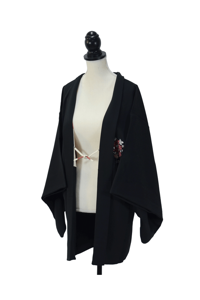 Vintage Haori with floral embroidery and Shibori lining on a black background